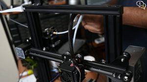 Open up zip ties to snake wire through harness