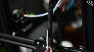 Open up zip ties to snake wire through harness