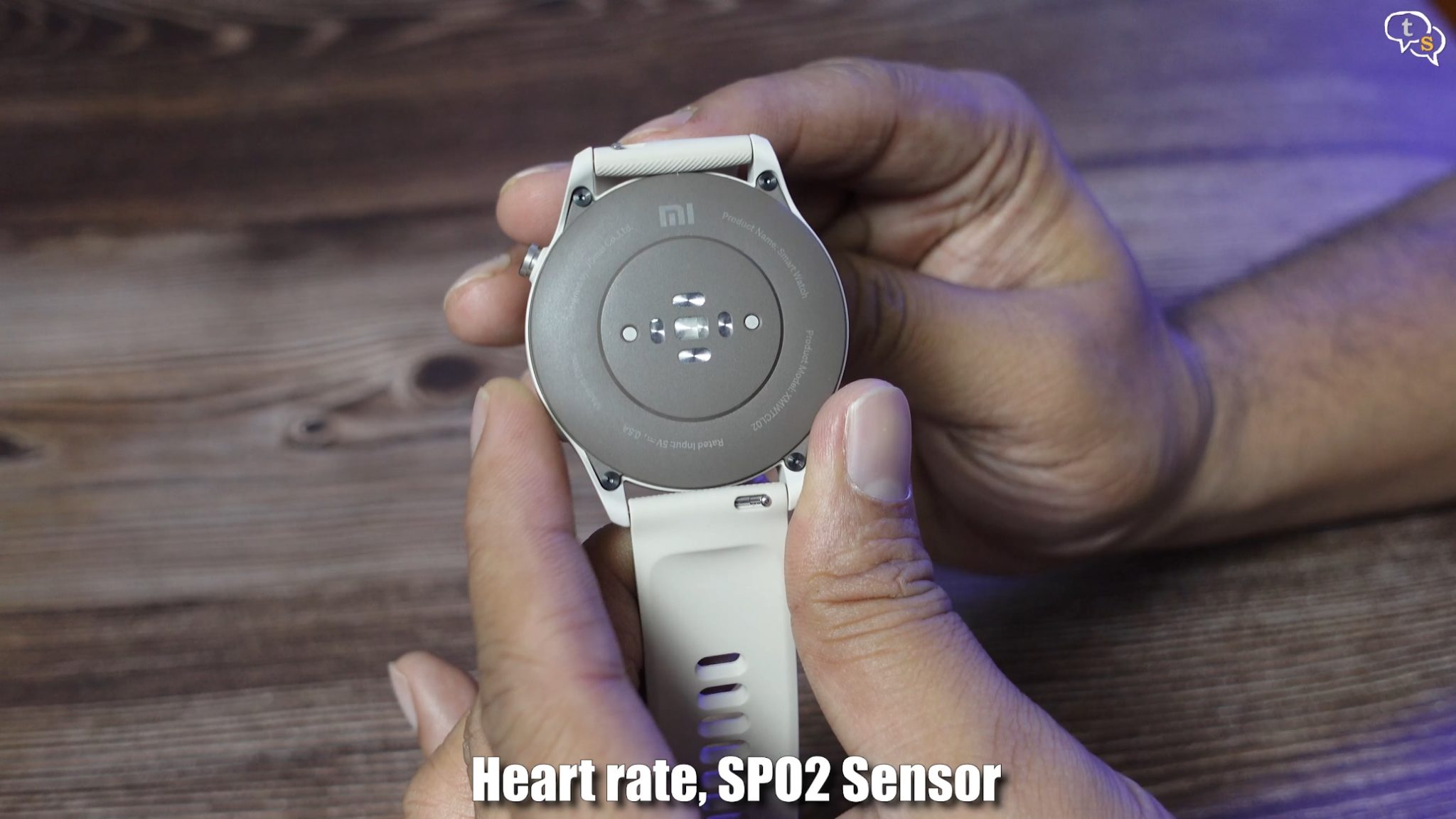 A person holding a watch Description automatically generated with low confidence