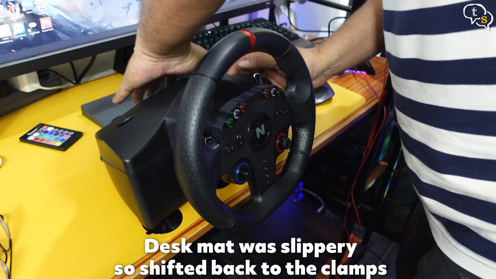 A person holding a steering wheel Description automatically generated with medium confidence