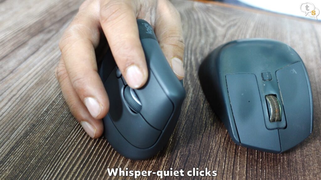 A person's hand on a computer mouse Description automatically generated with medium confidence