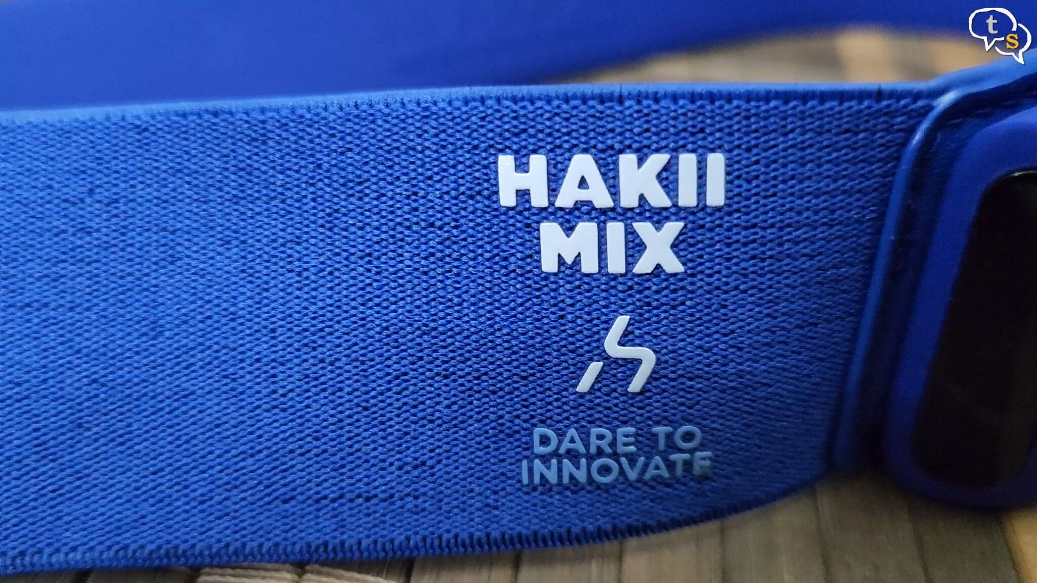 A blue band with white text on it Description automatically generated with medium confidence